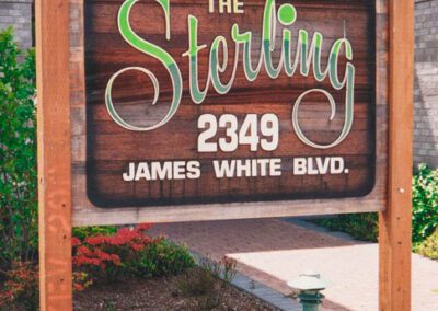 Cedar Sandblasted Strata Sign - drive by and you will see the sign installed now on the building